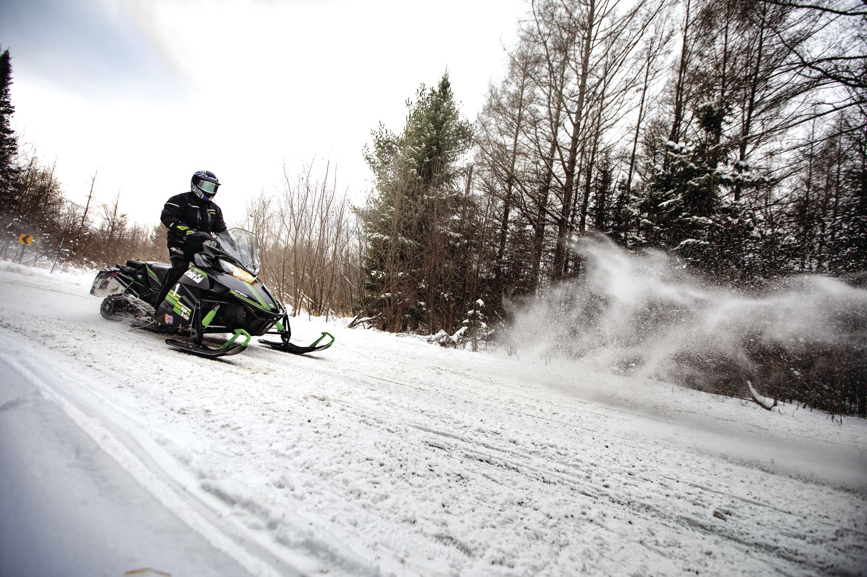 22 Snowmobile Rider on Snowmobile Trail in Eagle River.jpg
